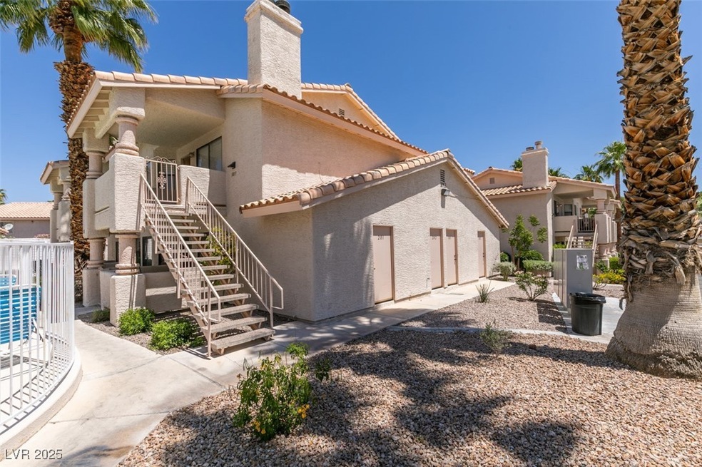 Rear view of property featuring stucco siding, sta