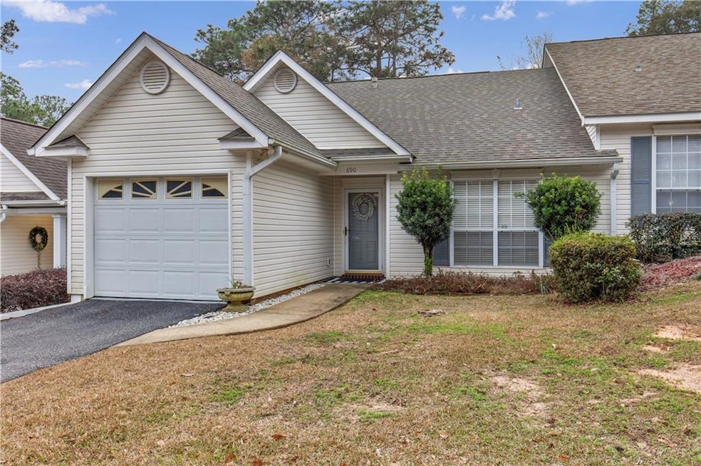 View of front of home featuring a garage and a fro