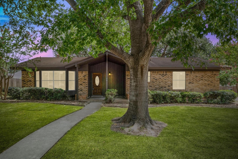 View of front facade featuring brick siding and a