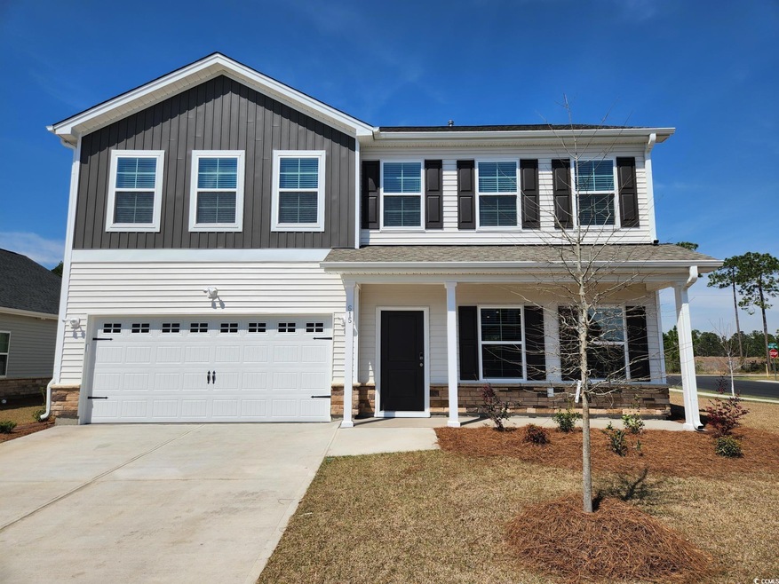 View of front of property with an attached garage,