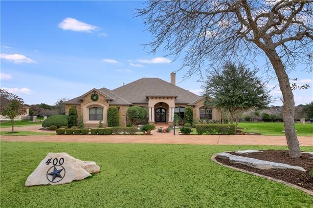 Impressive curb appeal with convenient circle drive.