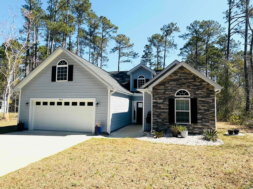 View of front of property featuring a front lawn, 