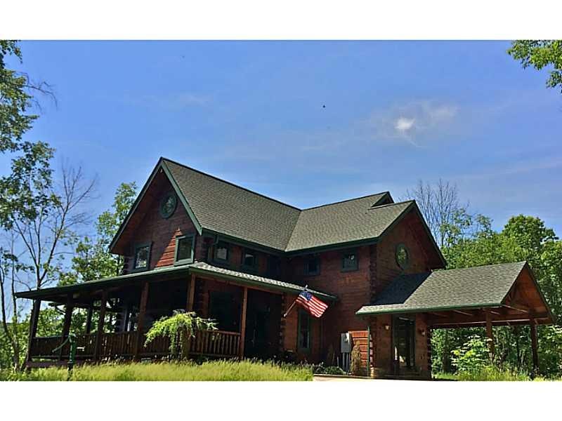 Exterior Front. Dazzling Handcrafted Amish Log Hom