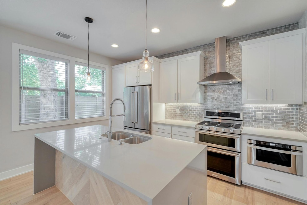 Kitchen featuring appliances with stainless steel