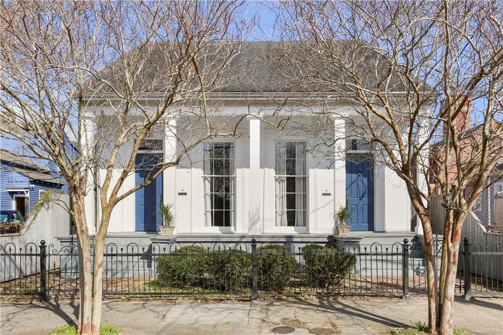 Exterior facade, large front porch over looking ga