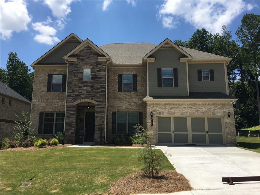 Four sides brick with stone and shake accents.
