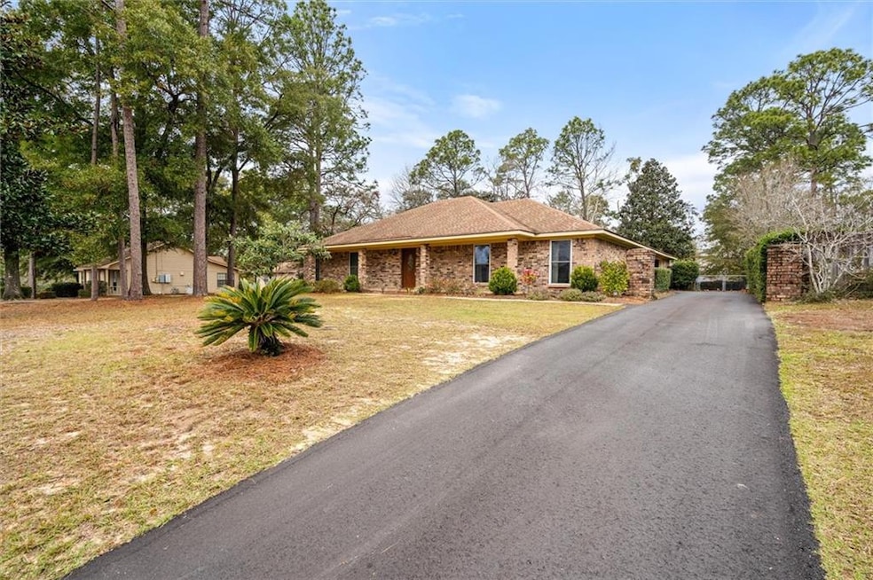 Ranch-style home with a new driveway and nice fron