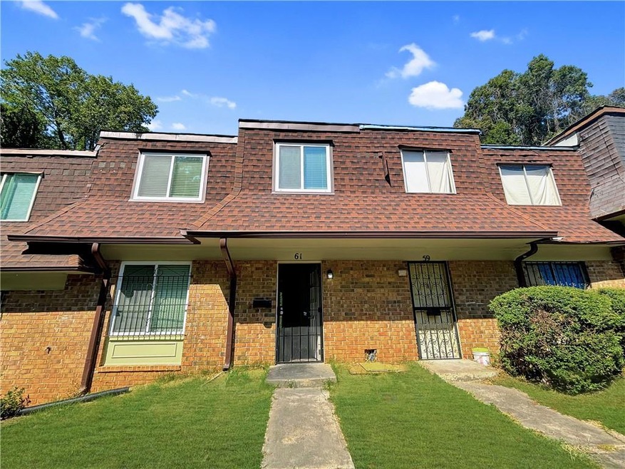 Townhome / multi-family property with a porch and 