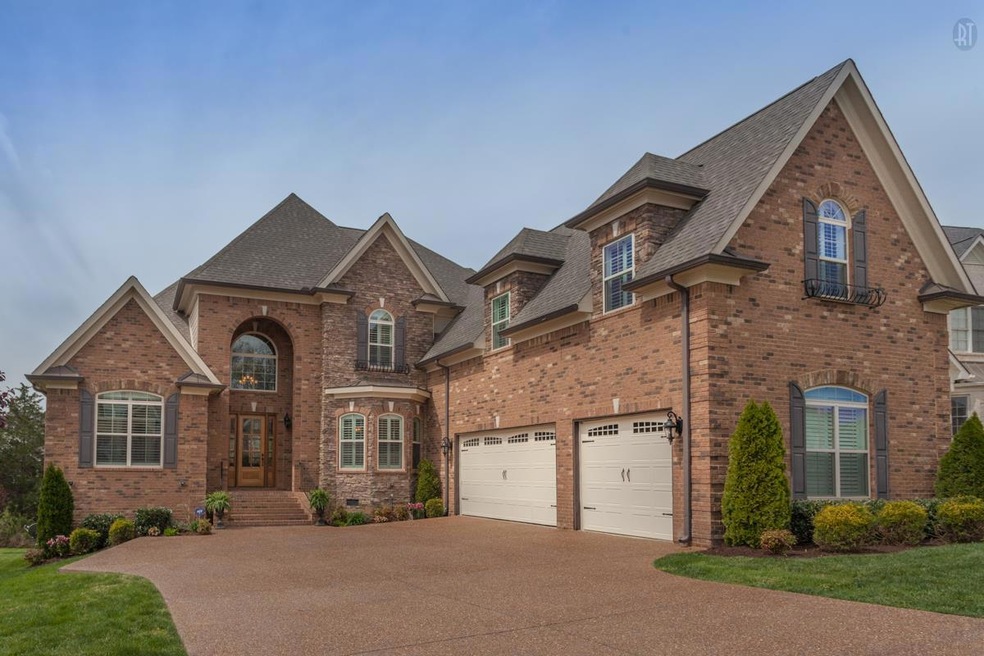 Beautiful entry with large driveway and 3 car garage