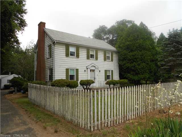 Exterior Front. House with workshop in rear.