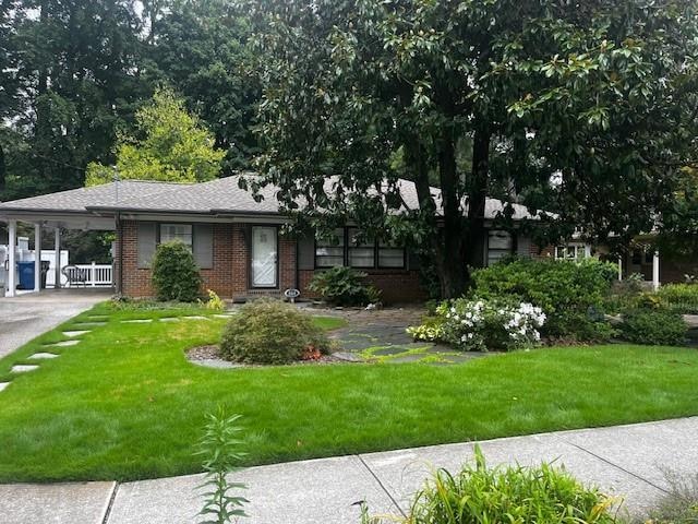 View of front of property featuring a front yard