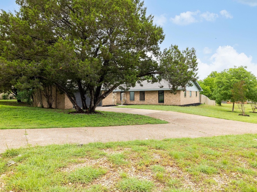 View of front of property featuring concrete driv