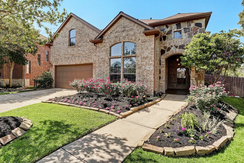 Stunning entrance is surrounded by delightful flower beds. The roof has been recently replaced (2017) with a transferable warranty and recently replaced trane AC units and furnaces (2020).