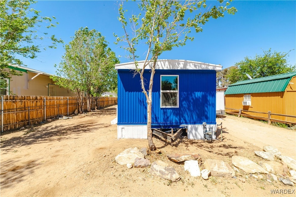 View of shed with fence