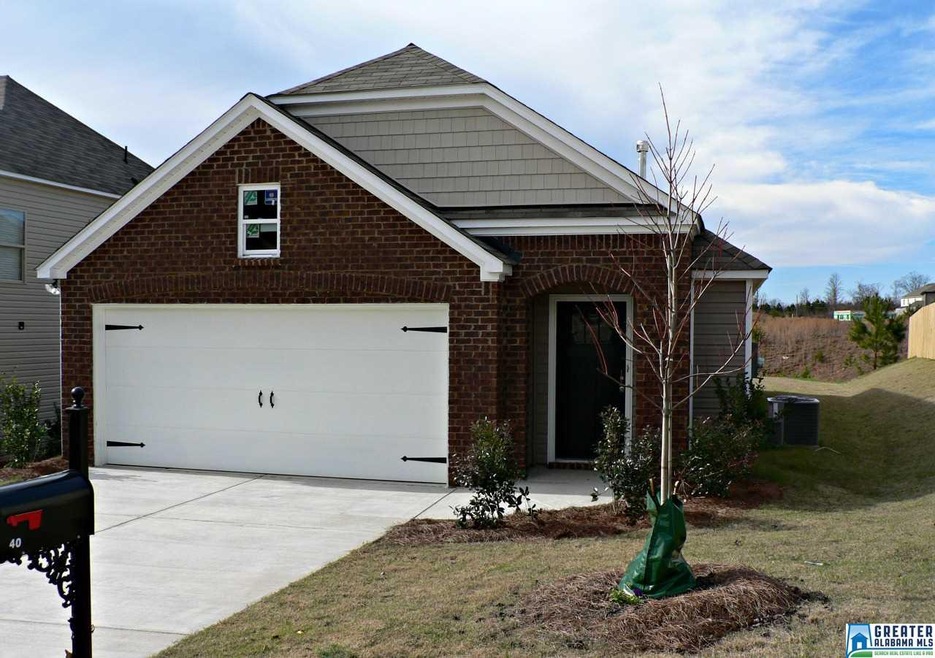 elegant brick front with decorative arch leading t