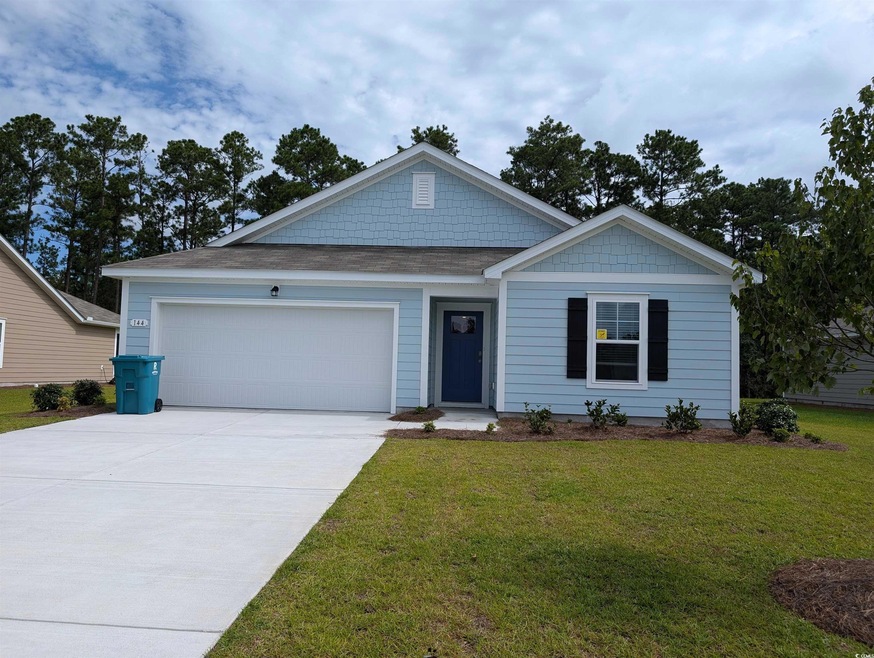 View of front of home featuring a garage and a fro