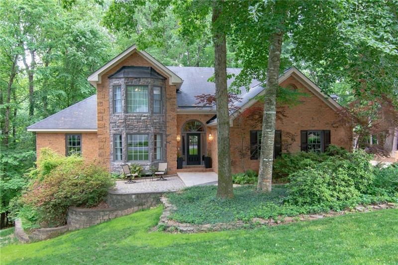 Front view of the brick and stone home with matchi