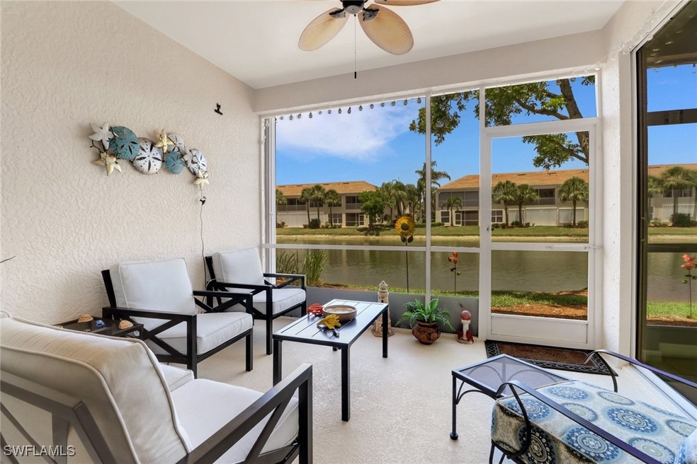 Sunroom featuring a water view, ceiling fan, and o