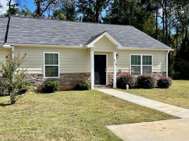 View of front of house featuring a front lawn