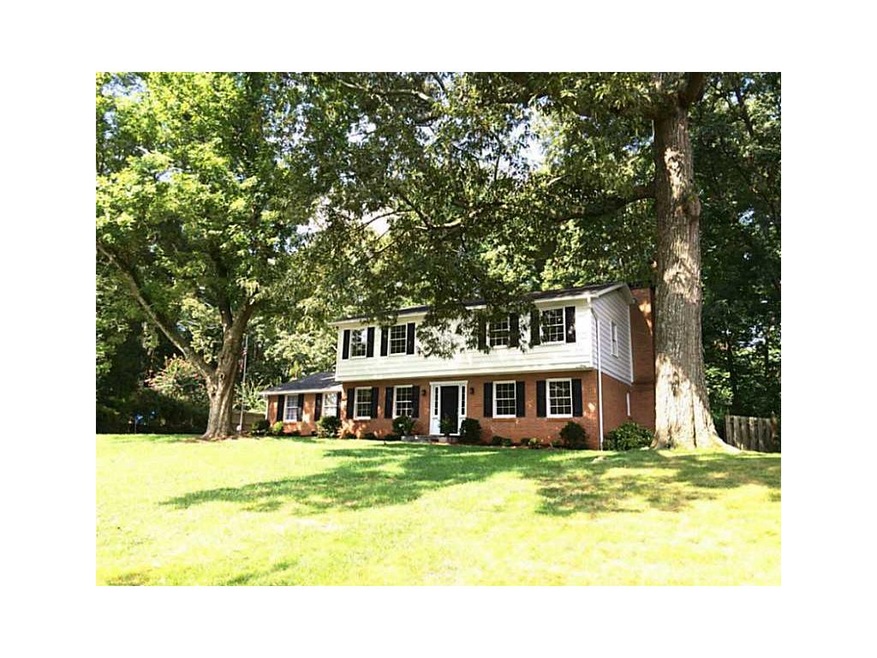 Facade/Exterior Front. Nestled on quiet setting wi
