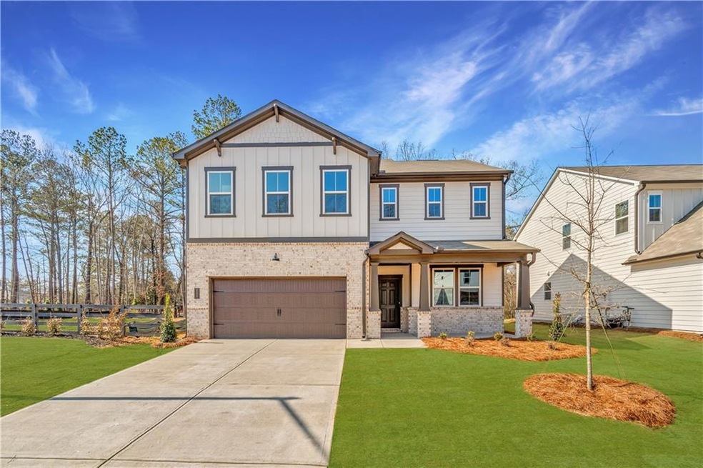 Craftsman-style house with a garage and a front la