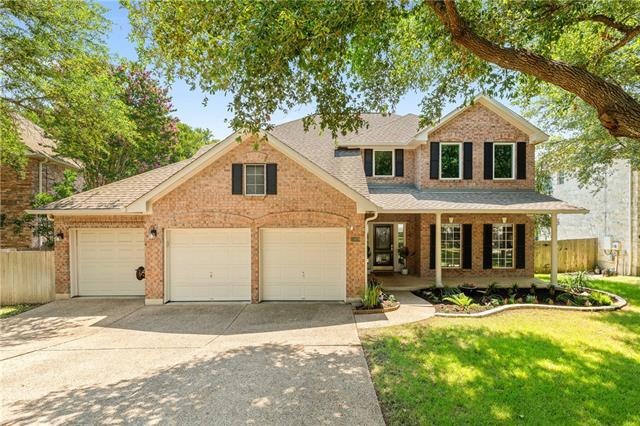 Magnificent trees shade this beautiful 4 bedroom 3