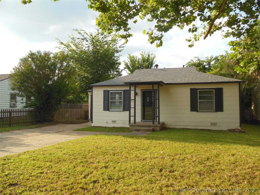 Gotta love the sweet cottage curb appeal.  Extra l