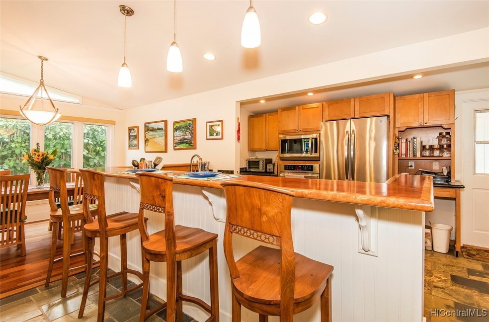 Open great room and kitchen area with slate floori