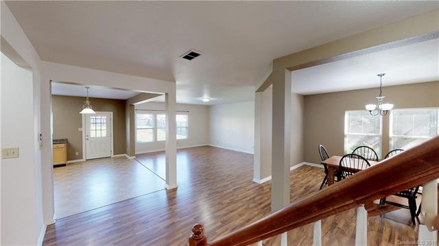 View of beautiful open floor plan from main stairc