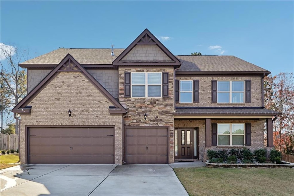 View of front of home featuring a shingled roof, c