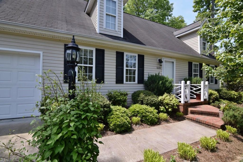 1600 Cos Cob Court, High Point.  Beautiful Cape Cod with low maintenance vinyl siding.
