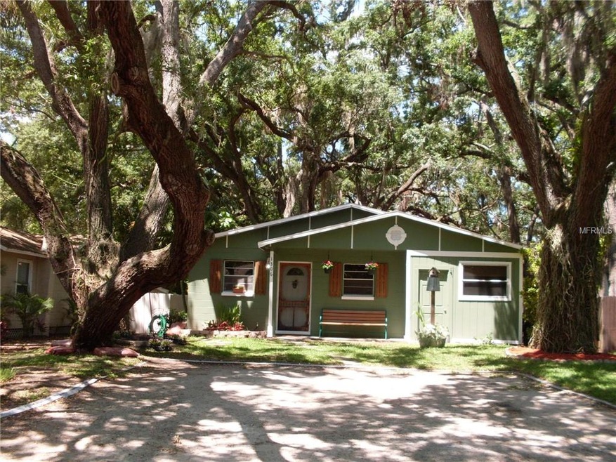 Tree shaded lot with parking pad.