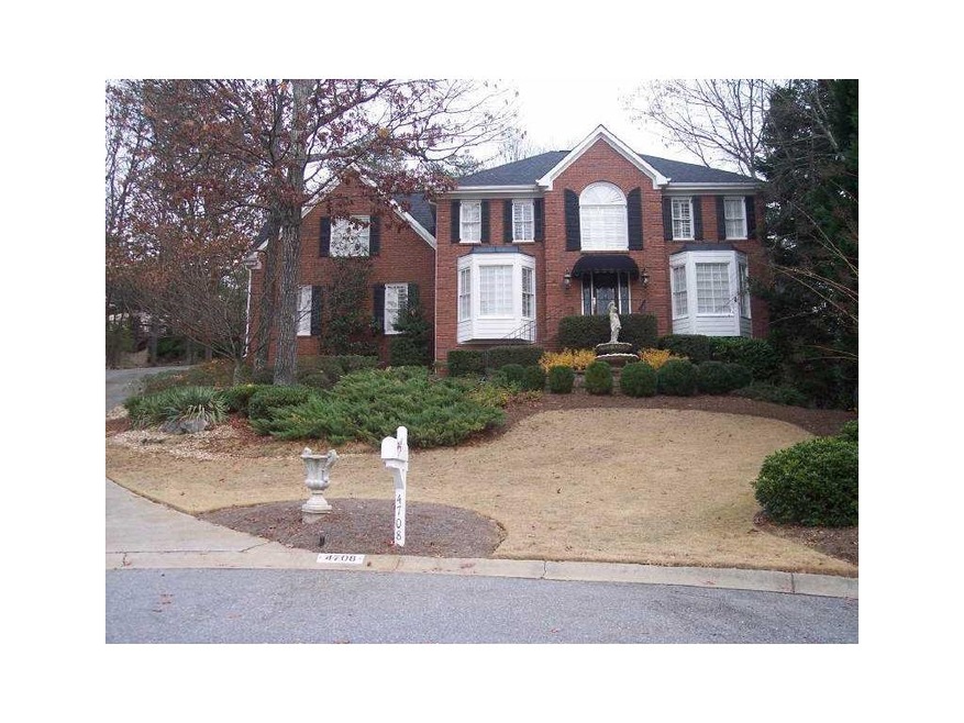 Exterior Front. Three sides brick home with large 
