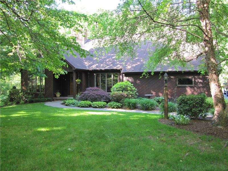 Cedar Home with Floor to Ceiling Windows and Profe