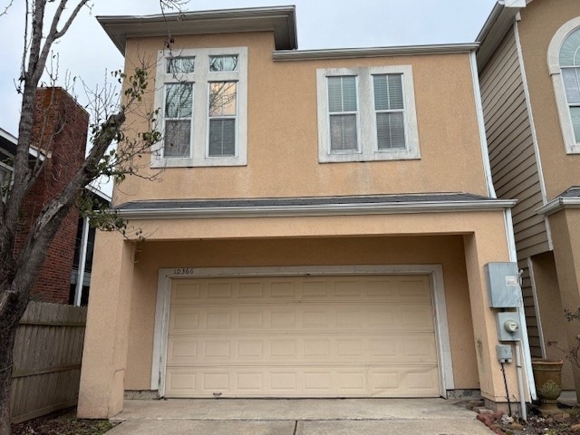 This is a two-story home with a light exterior and
