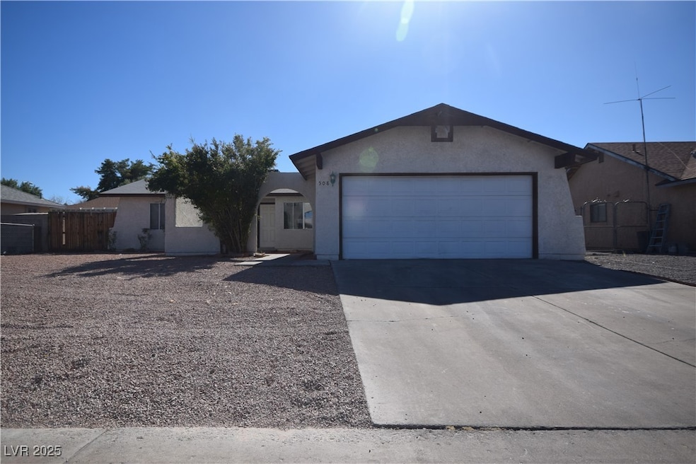 Ranch-style house featuring an attached garage, fe