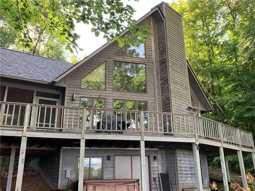 Welcome to this beautiful cedar-sided lake cabin! Enjoy the amazing lake view from the huge front deck or side screened-in area!