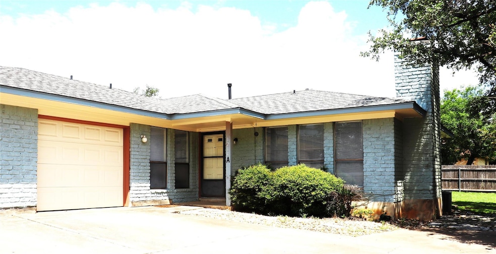 View of front of house featuring an attached gara