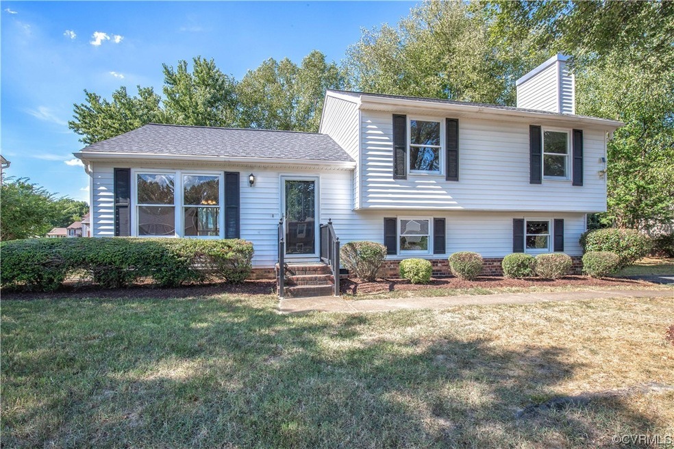Tri-level home with a front yard