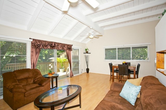 Open floor plan with vaulted ceiling