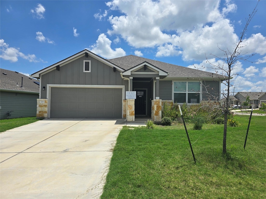 Craftsman house featuring a garage, concrete driv