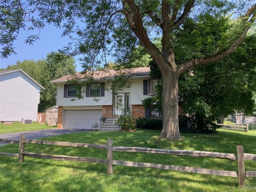 Shaded by a lovely tree with a split rail fence in the front, this established home is waiting for its new owners.