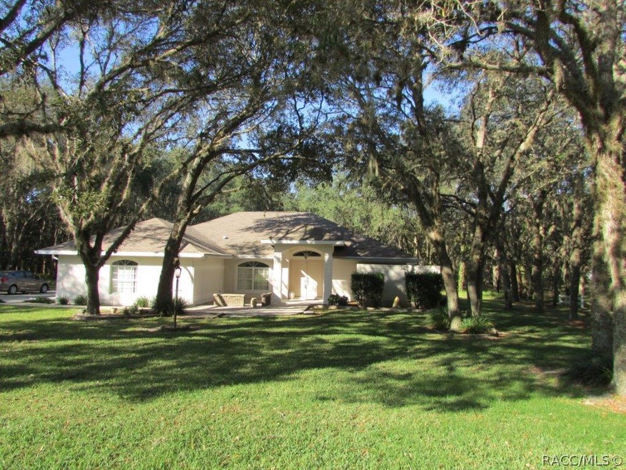 Great oaks frame the home