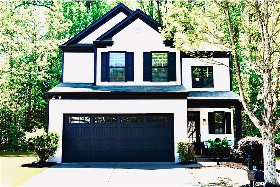 View of front facade featuring a garage
