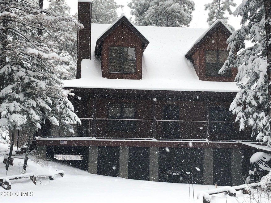 cabin front with snow