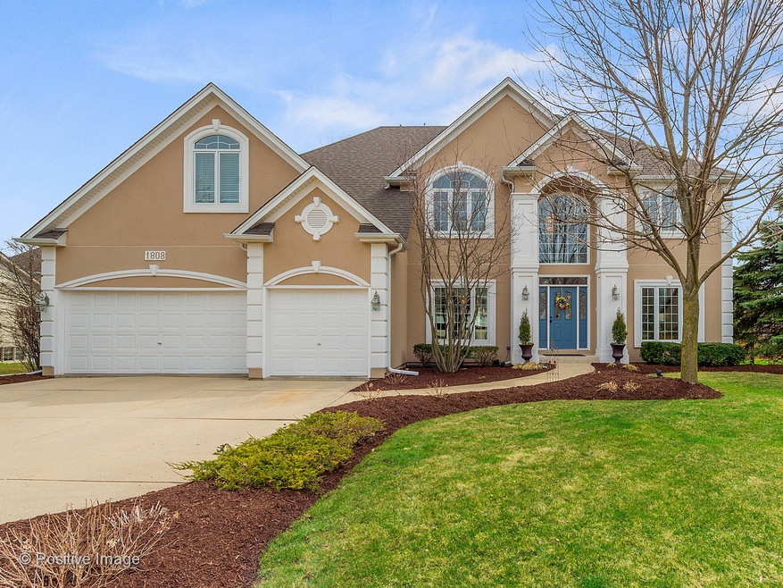 Stunning curb appeal, professionally landscaped & 