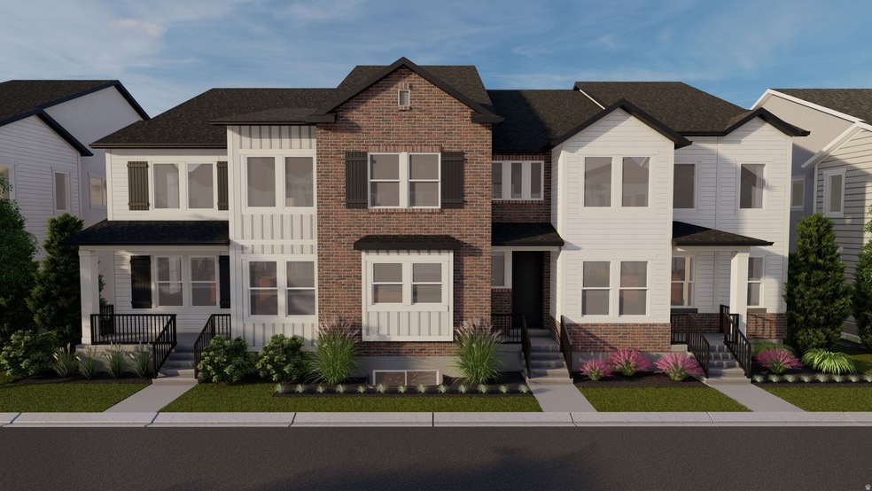 View of front of home with brick siding, board and batten siding, and a shingled roof