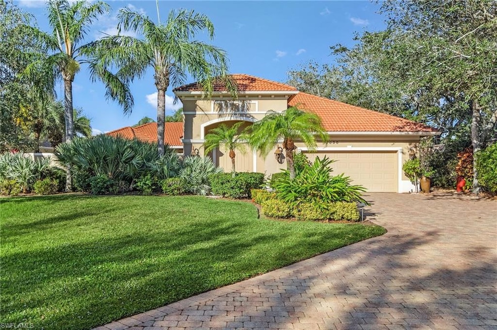 Mediterranean / spanish-style home with a garage a