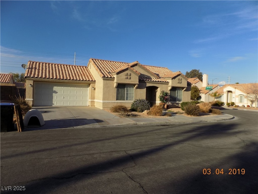 Mediterranean / spanish house featuring a tile roo