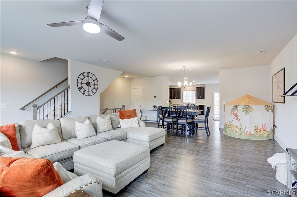 Living room with  hardwood / wood-style floors and